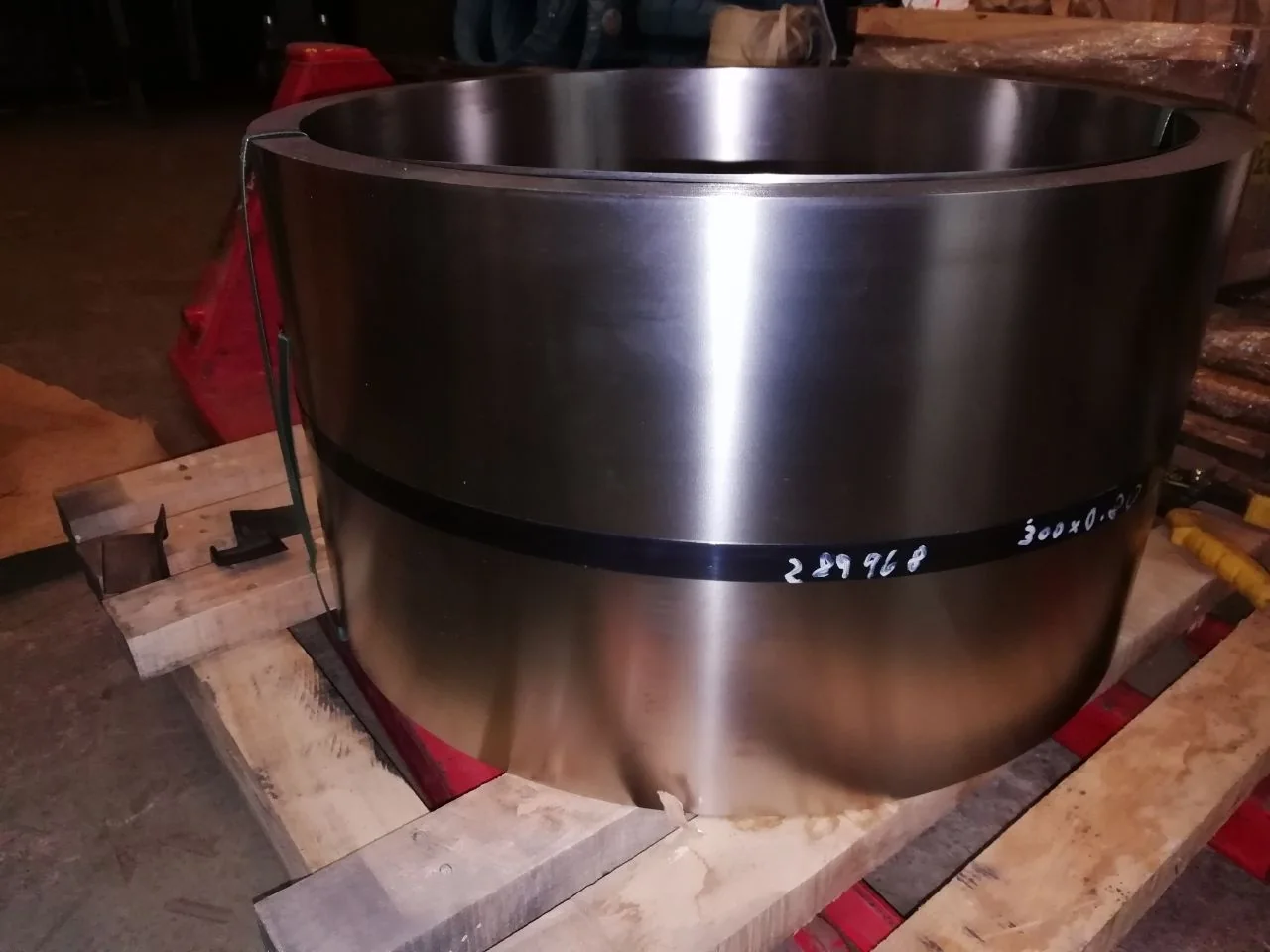 Large precision-machined metal ring prepared for industrial supply