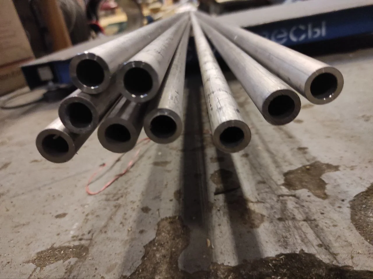 Precision hollow metal bars and tubes arranged for inspection